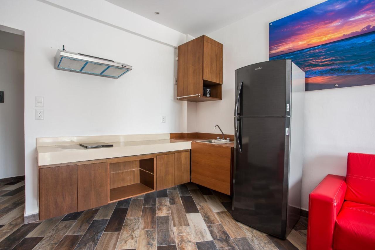 Capital O Cancun Ocean View, Cancún Exterior foto A typical kitchen in a studio apartment